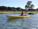 Photo of a sixth grader paddling to Taylors Island